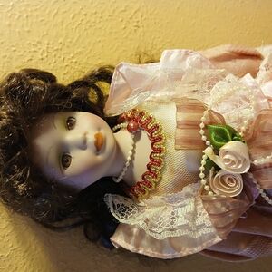 Elegant Porcelain Doll with Pink Dress